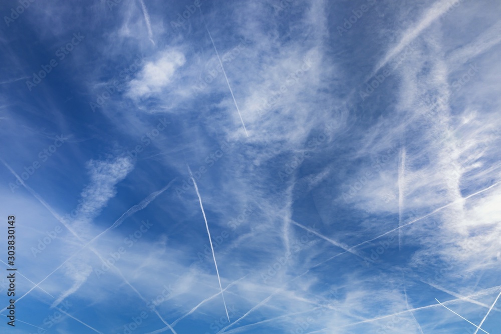 Fotografie Chemtrails over the blue sky