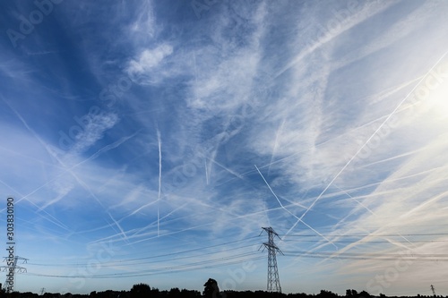 Chemtrails over the blue sky