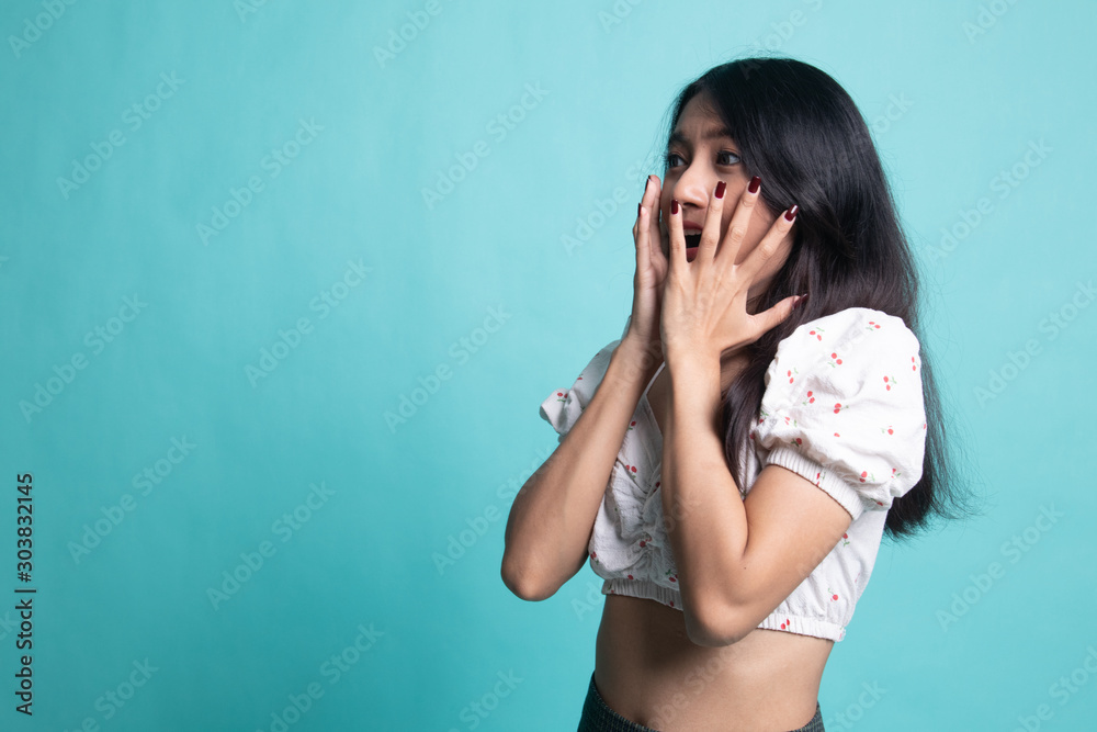Beautiful young Asian woman shocked and look up. Beautiful young Asian woman shocked and look up.