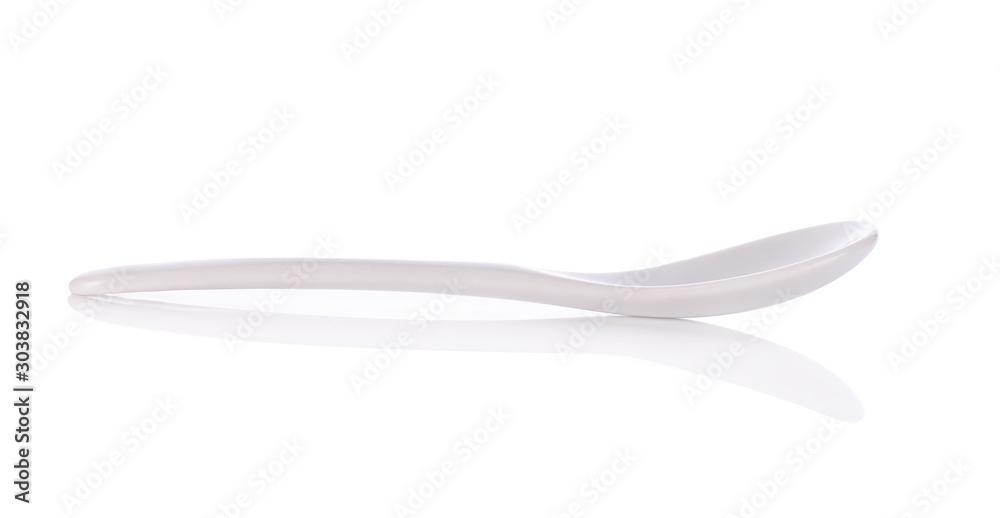 White ceramic spoon isolated on white background. White ceramic spoon isolated on white background.