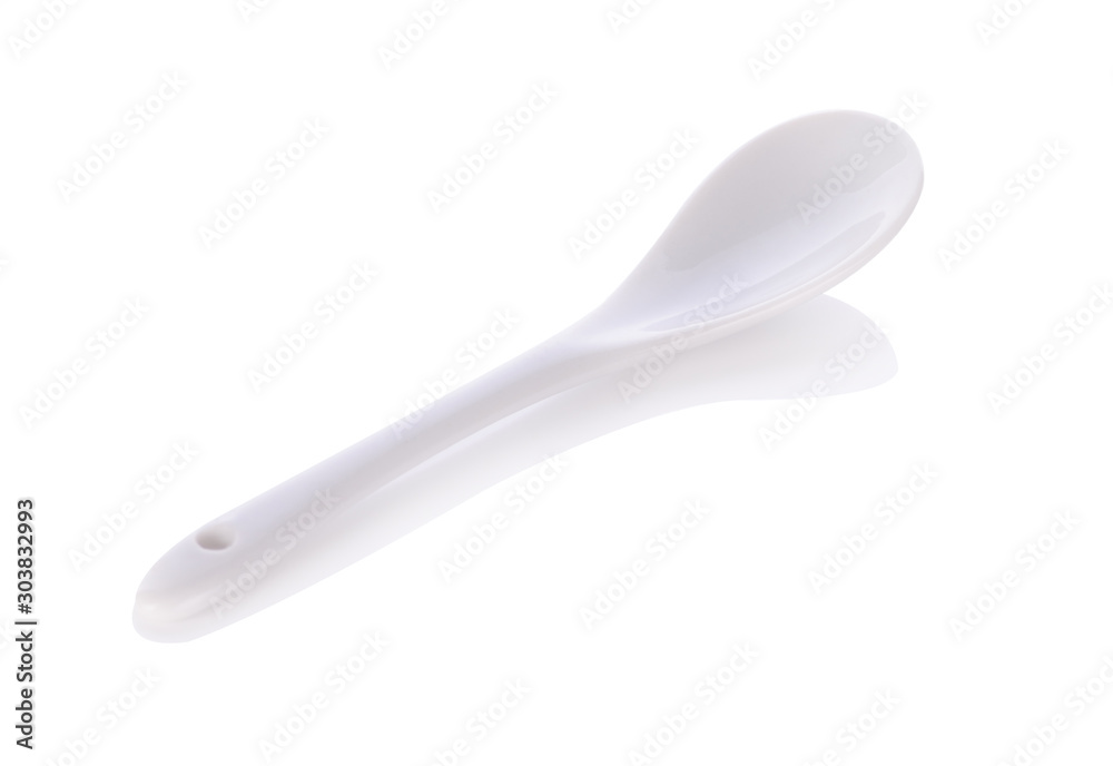 White ceramic spoon isolated on white background. White ceramic spoon isolated on white background.