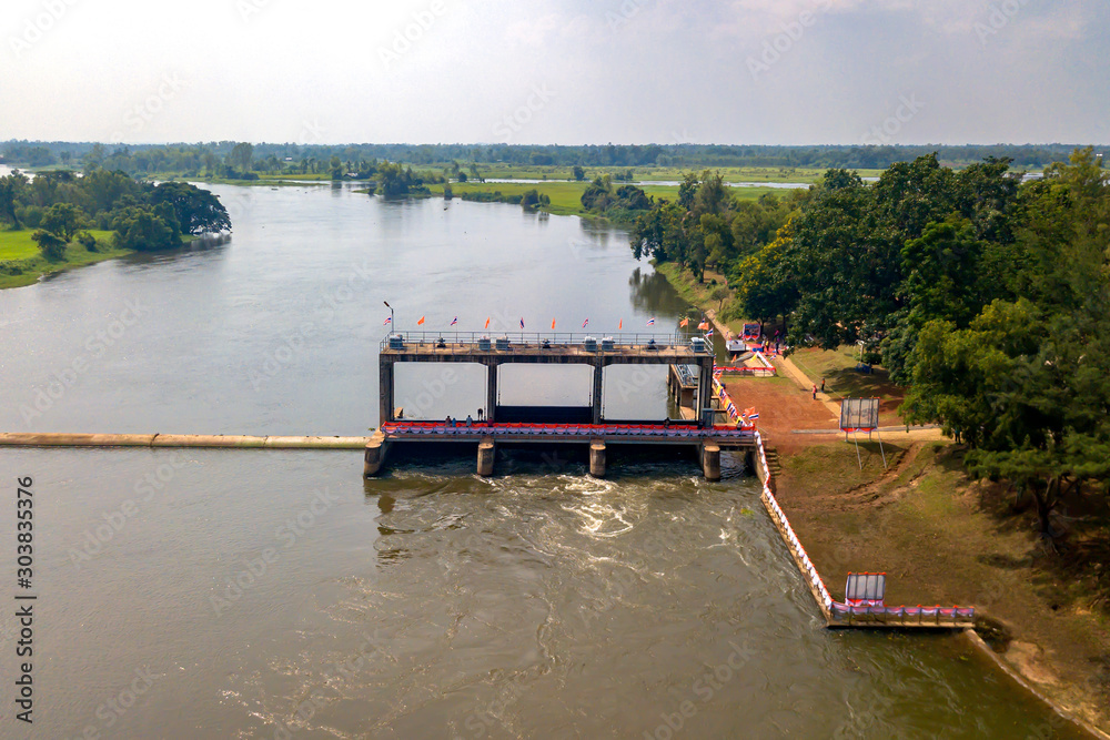 High angle view Surassawadi Watergate that controls the amount of Nong Han water Used in Sakon Nakhon province,Thailand. High angle view Surassawadi Watergate that controls the amount of Nong Han water Used in Sakon Nakhon province,Thailand.