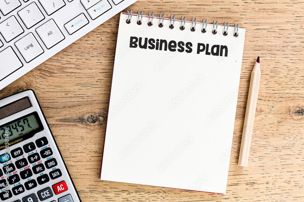 Fotografie Business plan text written in a notebook. View from above.