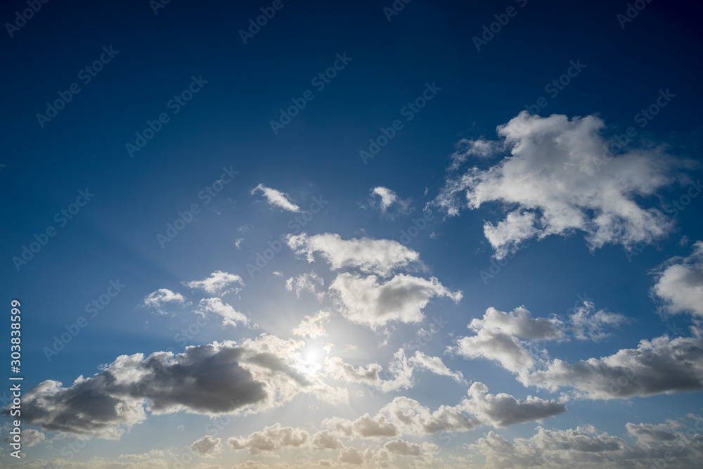 cloudscape with blue sky and sun for backgrounds cloudscape with blue sky and sun for backgrounds