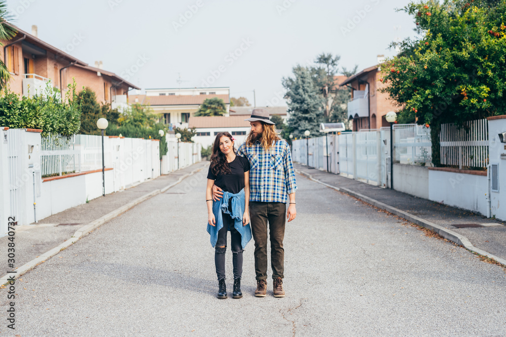 Young beautiful happy couple outdoor posing hugging