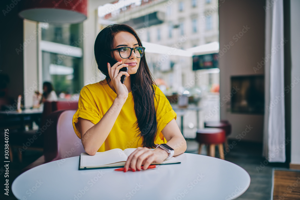 Εκτύπωση καμβά Brunette female financial manager in stylish optical spectacles talking on moder