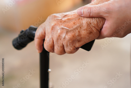 Senior hand holding a walking stick or a cane, isolated on white  background. Medical and healthcare concept. Back of hand side. 16802751  Stock Photo at Vecteezy