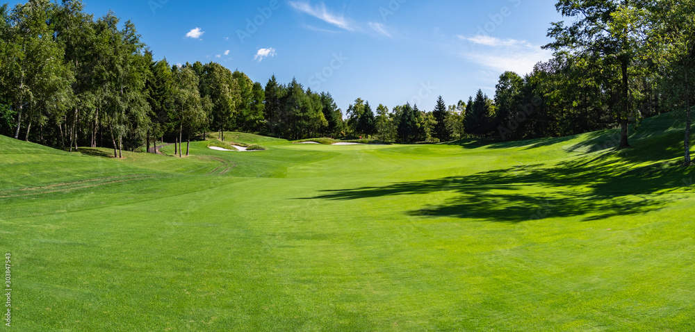 Golf Course with beautiful green field. Golf course with a rich green turf beautiful scenery.