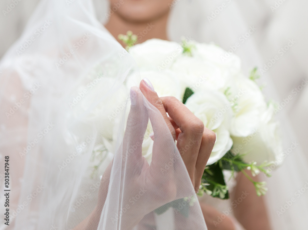 closeup of bride hands holding beautiful wedding bouquet closeup of bride hands holding beautiful wedding bouquet
