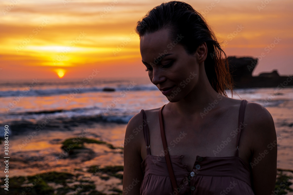 Woman against Pura Tanah Lot temple , Bali Woman against Pura Tanah Lot temple , Bali