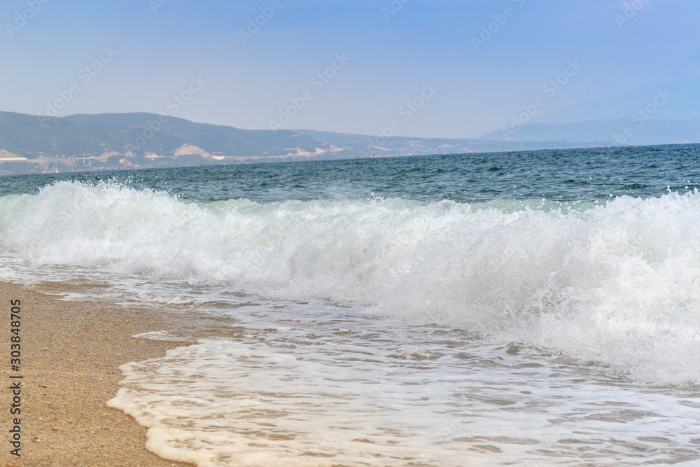 Waves crashing on the beach in Nea Vrasna