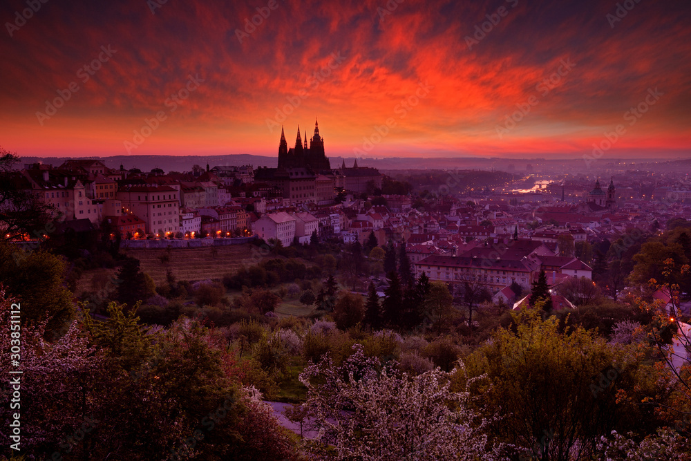 Twilight sunrise in Prague, Czech Republic, red orange cloud with old town. Beautiful Prague before sunrise, Central Europe. City landscape from beautiful town. Night travelling in Europe.