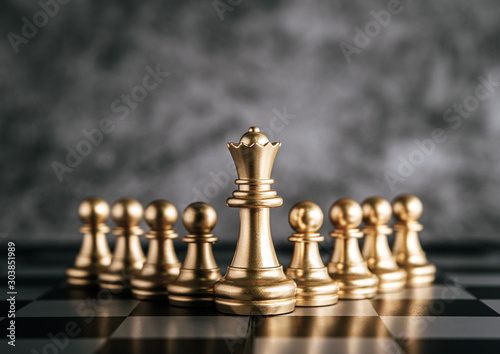 Gold Chess on chess board game for business metaphor leadership concept