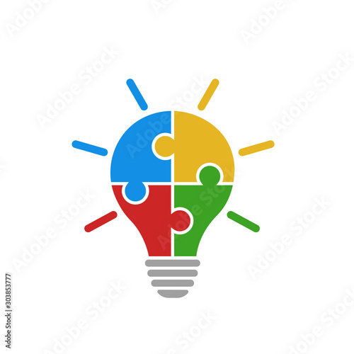 Light bulb vector icon from colorful jigsaw puzzle pieces on white background. Four puzzle pieces connected to each other