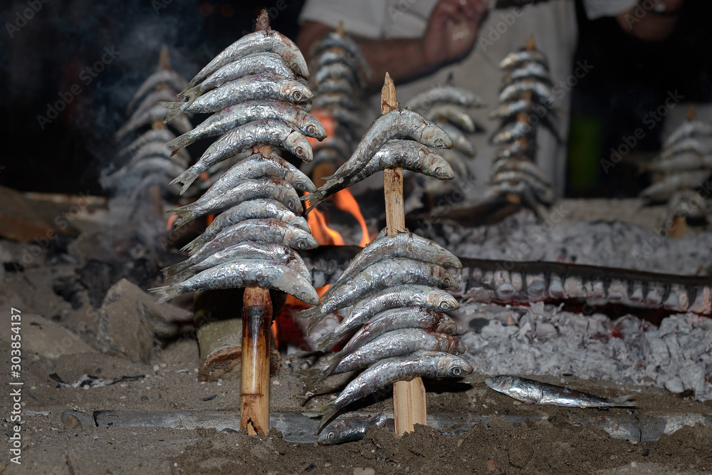 Ταπετσαρία sardine spit in San Juan night at the beach