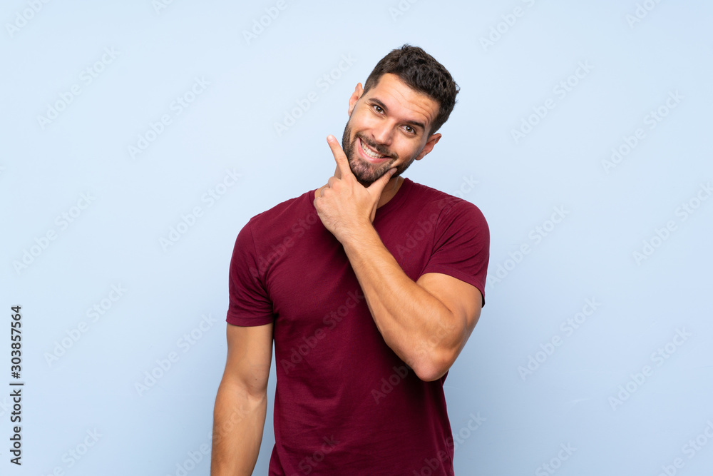 Handsome man over isolated blue background smiling Handsome man over isolated blue background smiling