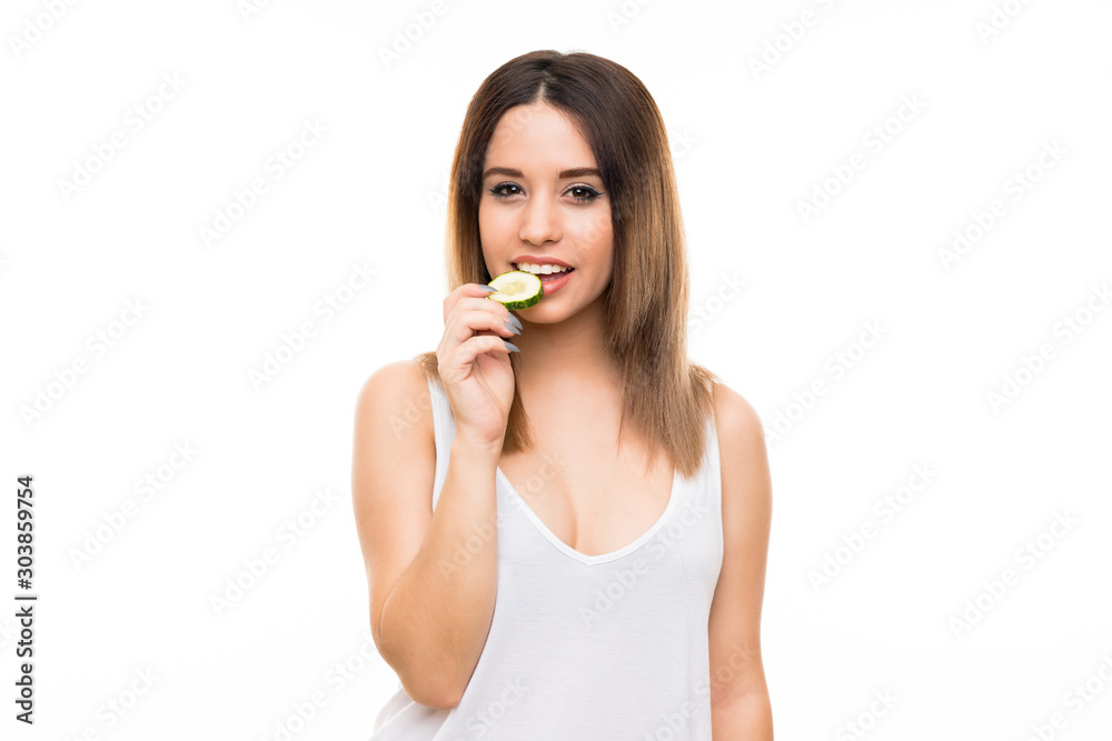 Beautiful young woman holding slices of cucumber Beautiful young woman holding slices of cucumber