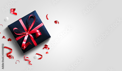 Decorative gift box with red bow and long ribbon. Happy Women s Day. Top view