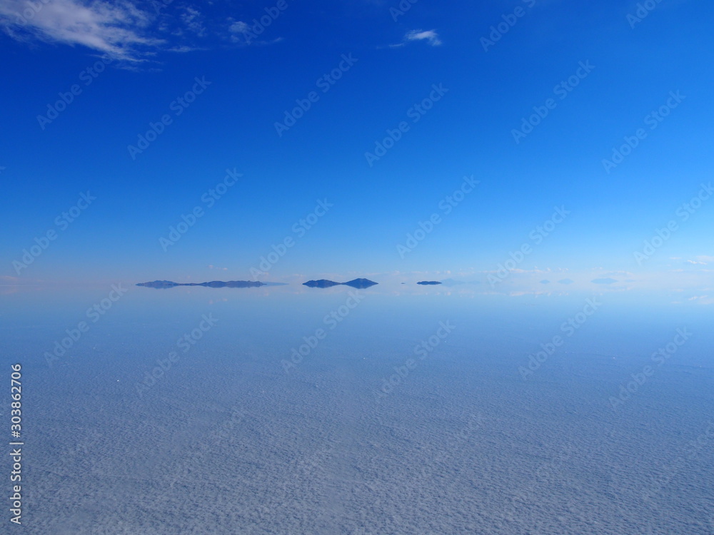 Beautiful mirror reflection on blue sky and cloud at Salar de Uyuni, Salar de Uyuni is the world's largest salt flat, Bolivia