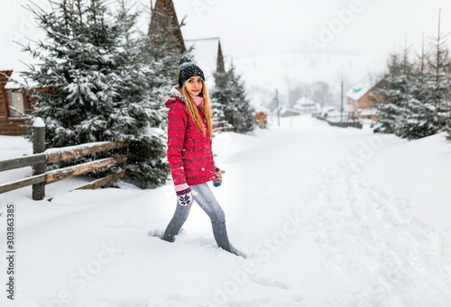 girl snowdrift outside village or country, winter cold snow weather, woman in red jacket or clothes outdoor countryside