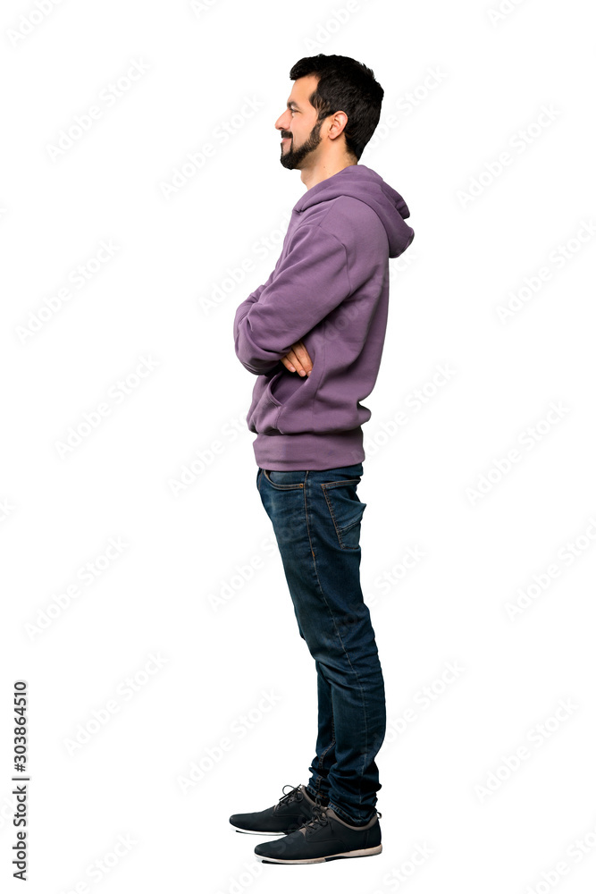 Full-length shot of Handsome man with sweatshirt in lateral position over isolated white background Full-length shot of Handsome man with sweatshirt in lateral position over isolated white background