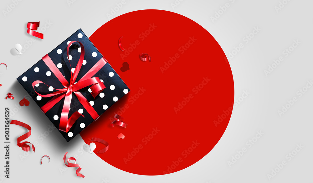 Decorative gift box with red bow and long ribbon. Happy Day. Top view