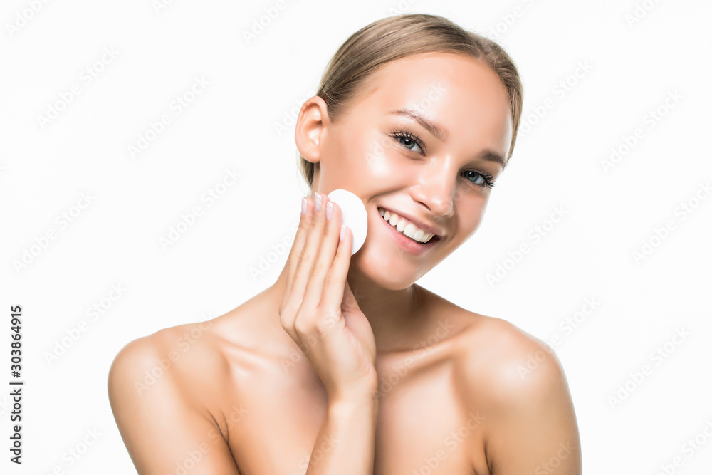 Portrait of beautiful woman cleaning her face with cotton swab isolated on white background Portrait of beautiful woman cleaning her face with cotton swab isolated on white background
