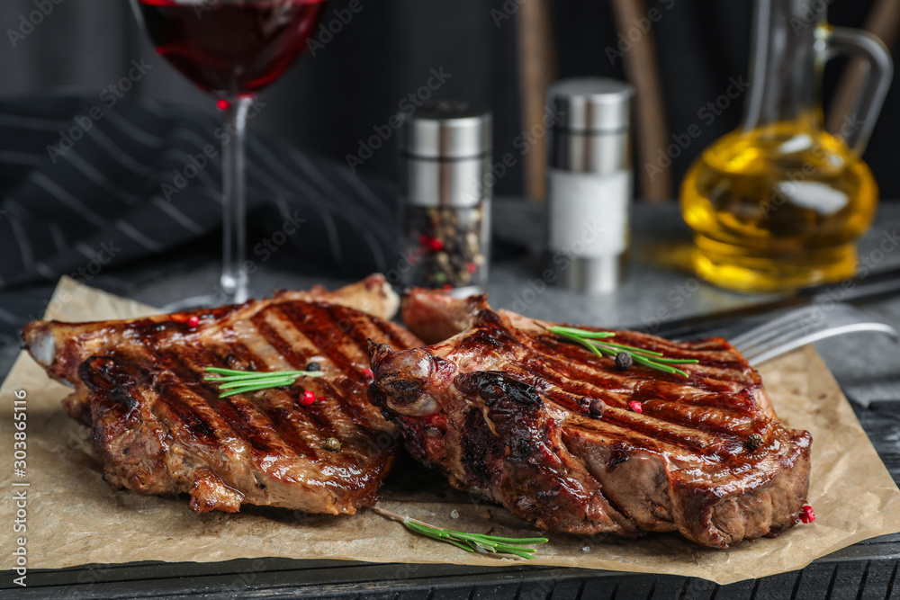 Delicious beef steaks served on table, closeup