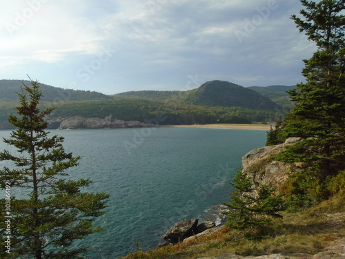 Rocky Maine Coast with the Atlantic Ocean reflecting off the water as it washes ashore