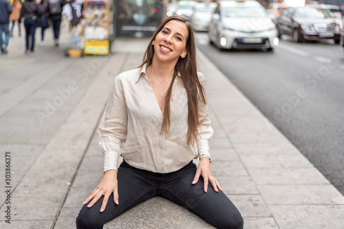 Girl sitting on a street bench