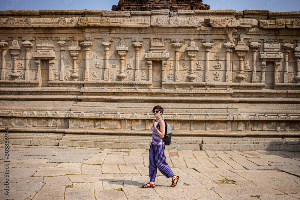 Girl travelers visiting the ruins of Hampi. Krishna Temple, Hampi, Karnataka state, India