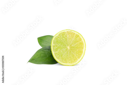 Half of lime with leaves isolated on white background. Juicy fruit