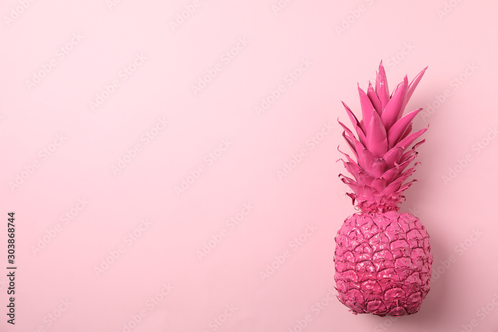 Fototapeta Painted pink pineapple on color background, space for text