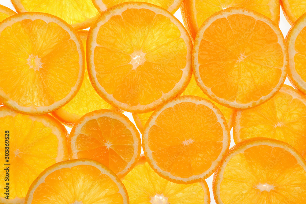 Slices of fresh tangerines as background, top view Slices of fresh tangerines as background, top view