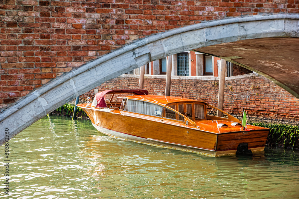Fototapeta premium Water taxi on canal street in Venice, Italy