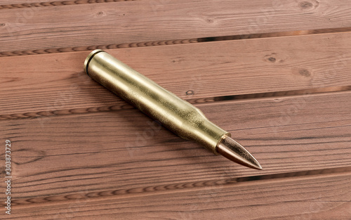 Golden bronze Rifle bullet on wooden table 3d render illustration