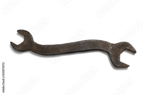 Old rusty stainless steel wrench isolated on white top view