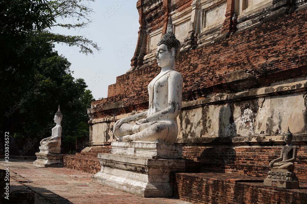 white seated stone statue of Buddha  Within the area of ​​Wat Yai Chaimongkol, Ayutthaya Thailand