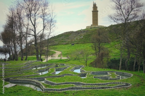 CORUNNA, SPAIN - APRIL 02, 2018: Park at the Atlantic Ocean and in close proximity to the famous Roman Tower of Hercules. Corunna is famous touristic city.