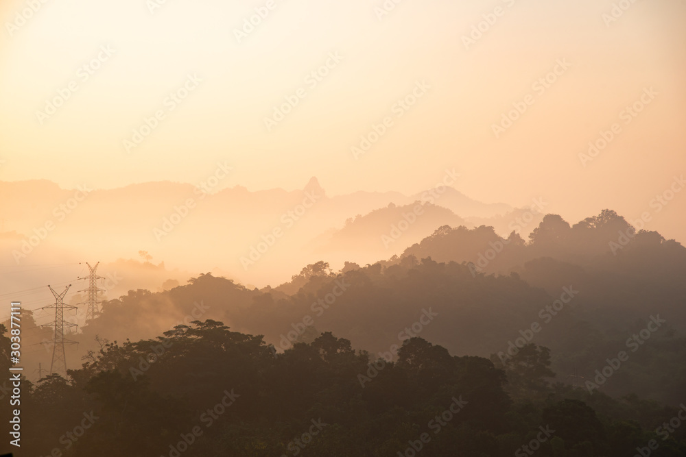 yellow bright multi layer mountain in morning view with mist