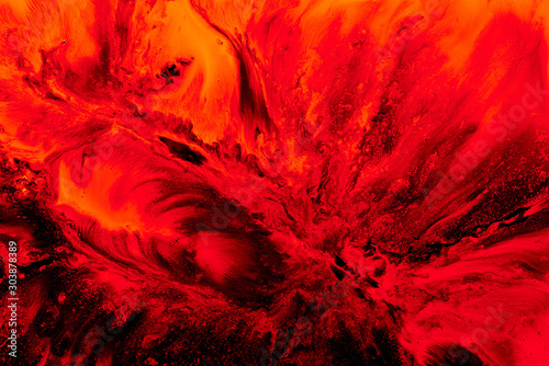 Abstract ruby nuclear explosion, liquid splash of wave of scarlet blood or red wine. Ocean of boiling lava photo