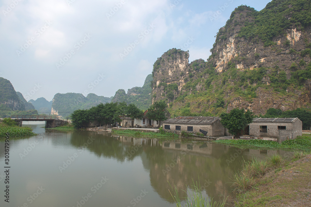 Panoramic view of karst formations and rice paddy fields in Tam Coc, a part of Trang An Complex , was  declared a UNESCO World Heritage Natural and Cultural Monument.Ninh Binh province, Vietnam