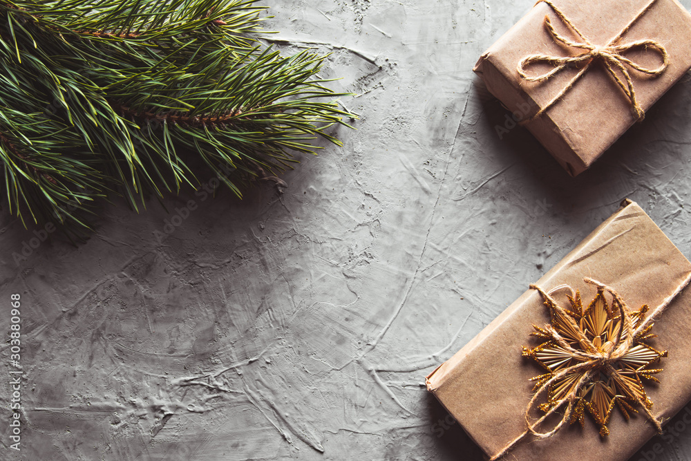 Fotografie A craft box for packing a Christmas present present decorated with raffia silver