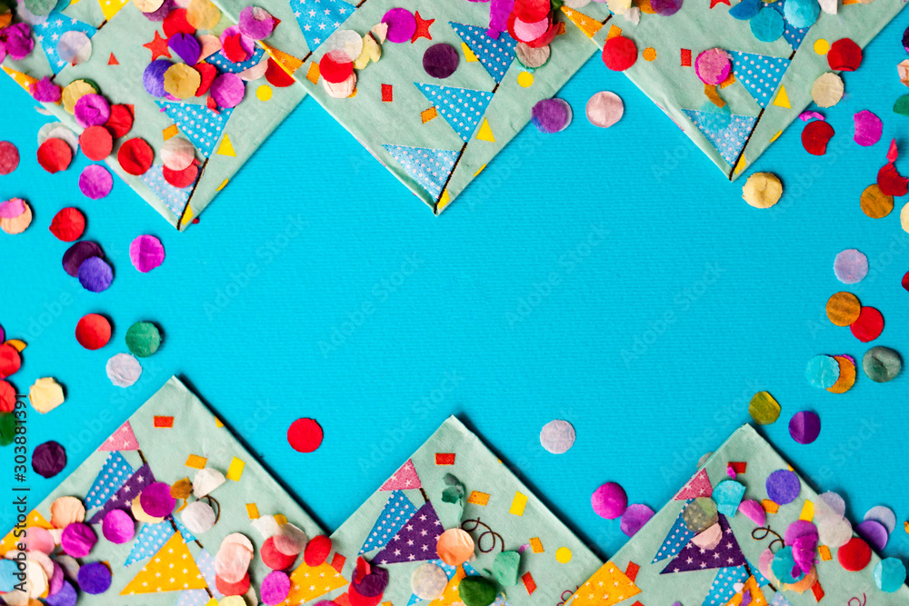 Fototapeta premium Colorful festive confetti Flat lay background frame Card for birthday Party, festival or carnival.