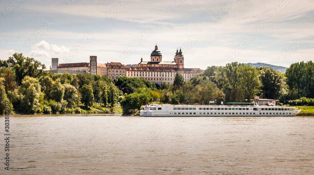 Melk Abbey, German: Stift Melk, with the Danube River and a boat Wachau Valley, Austria