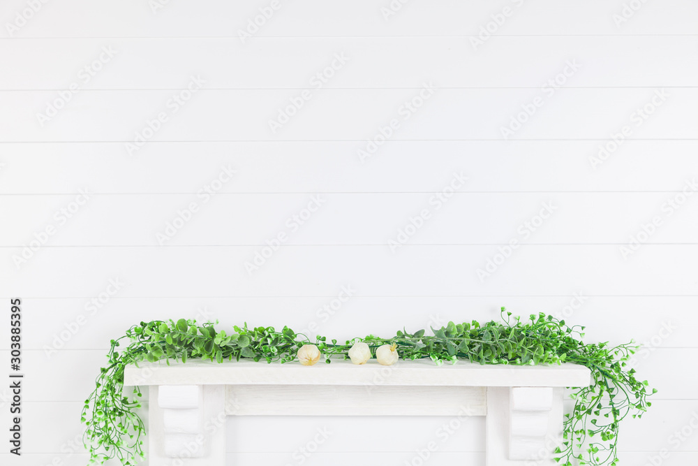 Fototapeta Mock up white wall in the interior with greenery