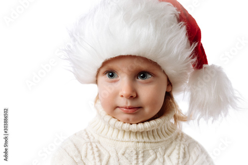 Cute Caucasian Kid In Santa Hat Closeup Portrait