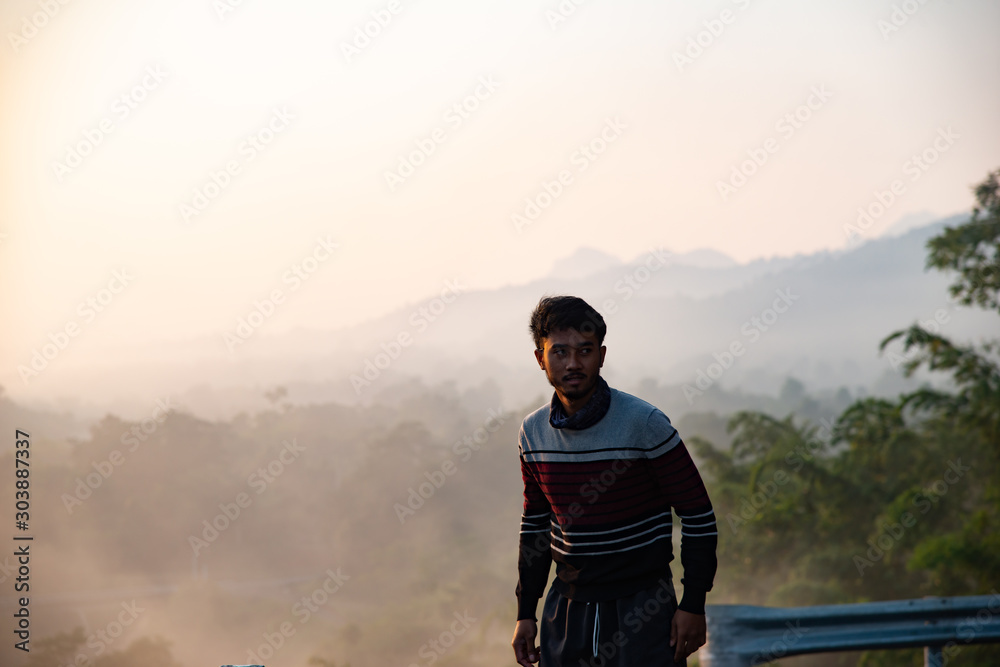 lonely healthy man standing in morning mist view