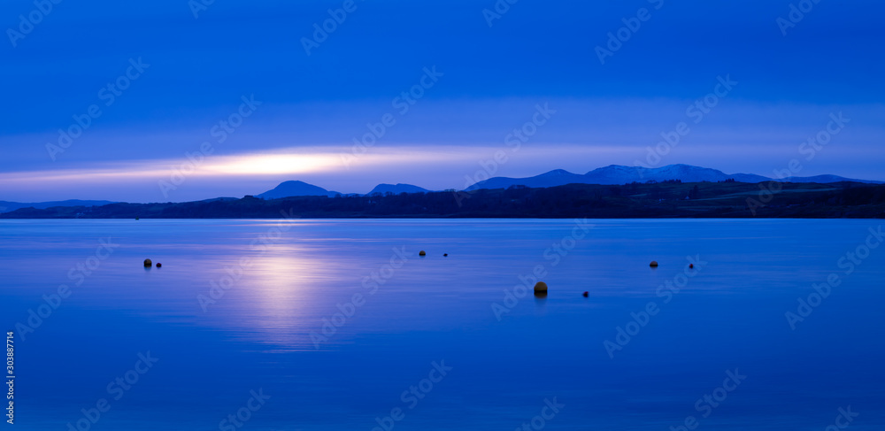 aerial panorama of loch linnhe on the west coast of scotland in the argyll region of the highlands near port appin and oban and fort william showing pink skies and calm blue water