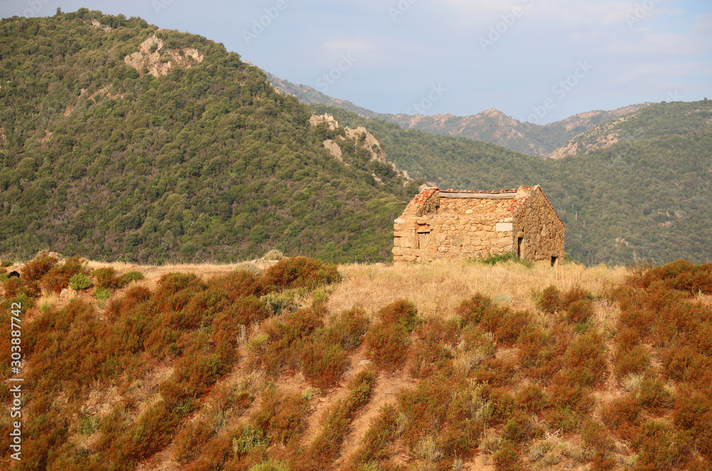 isolated house made of stone over the hill